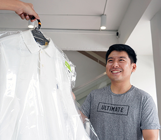 Image of a man wearing a gray shirt